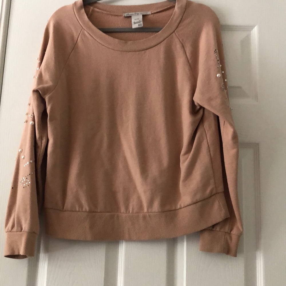 A Tan embellished sweater